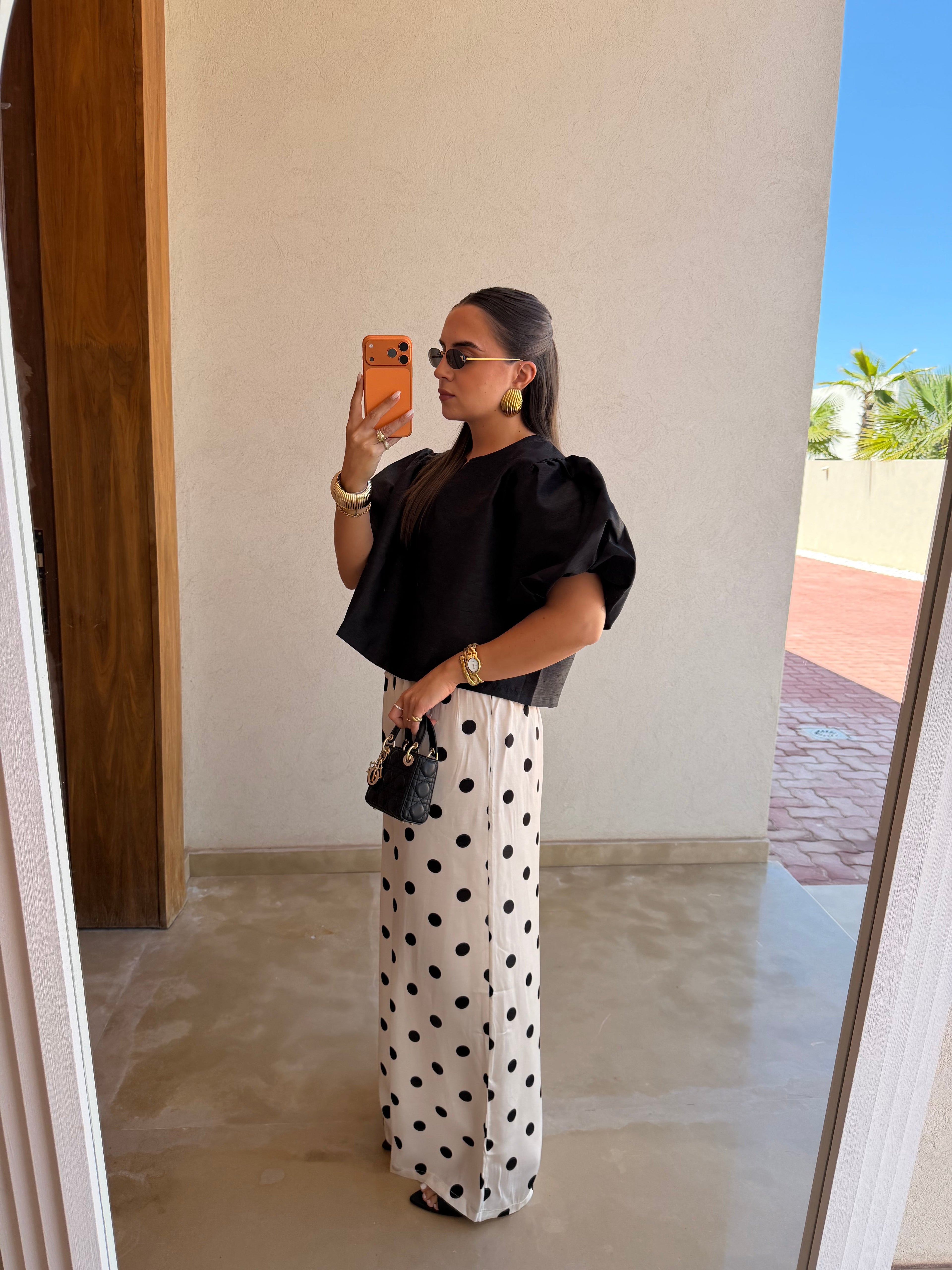 Pantalon satiné à pois blanc