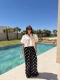 Pantalon satiné à pois noire