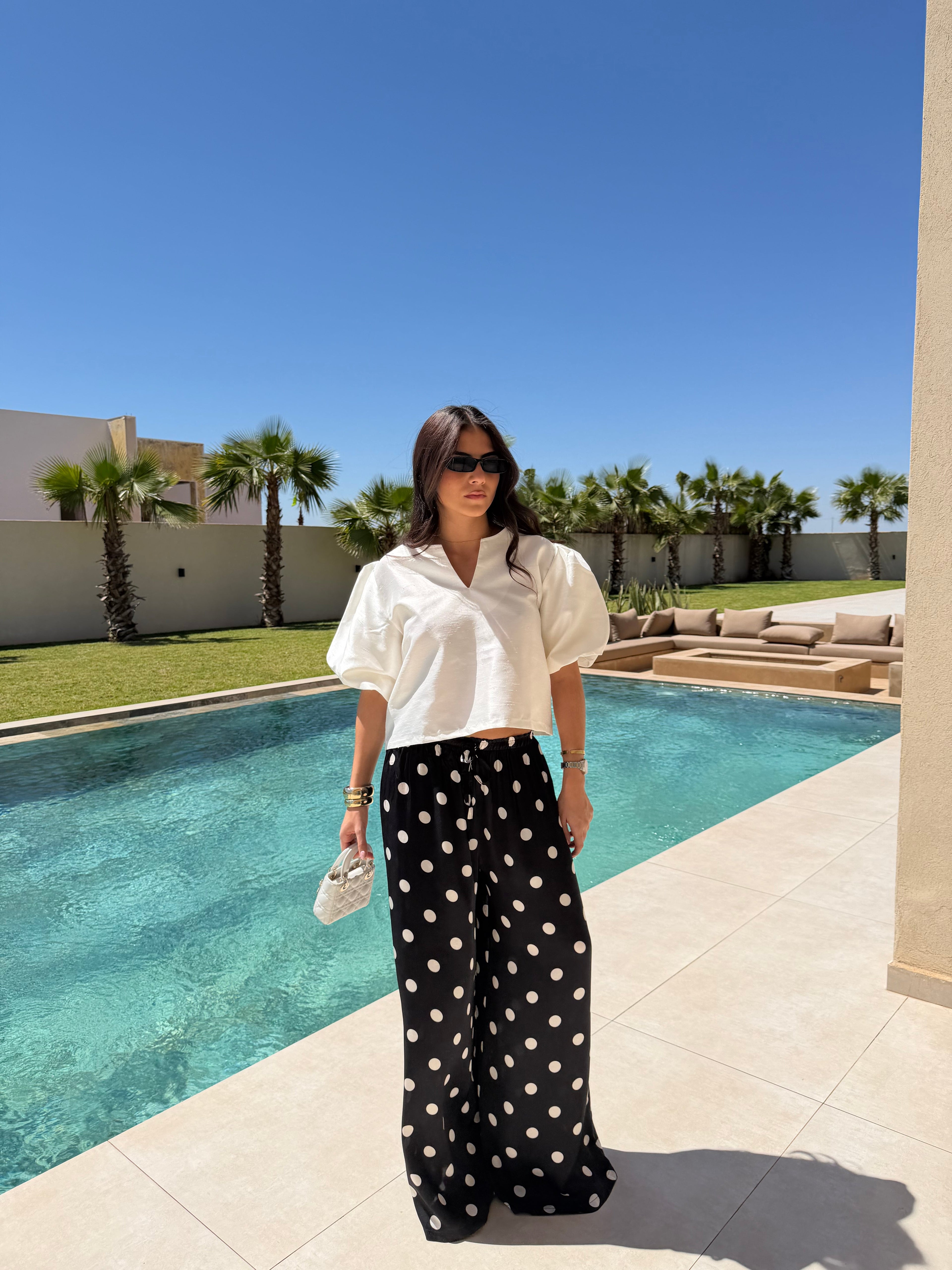 Pantalon satiné à pois noire