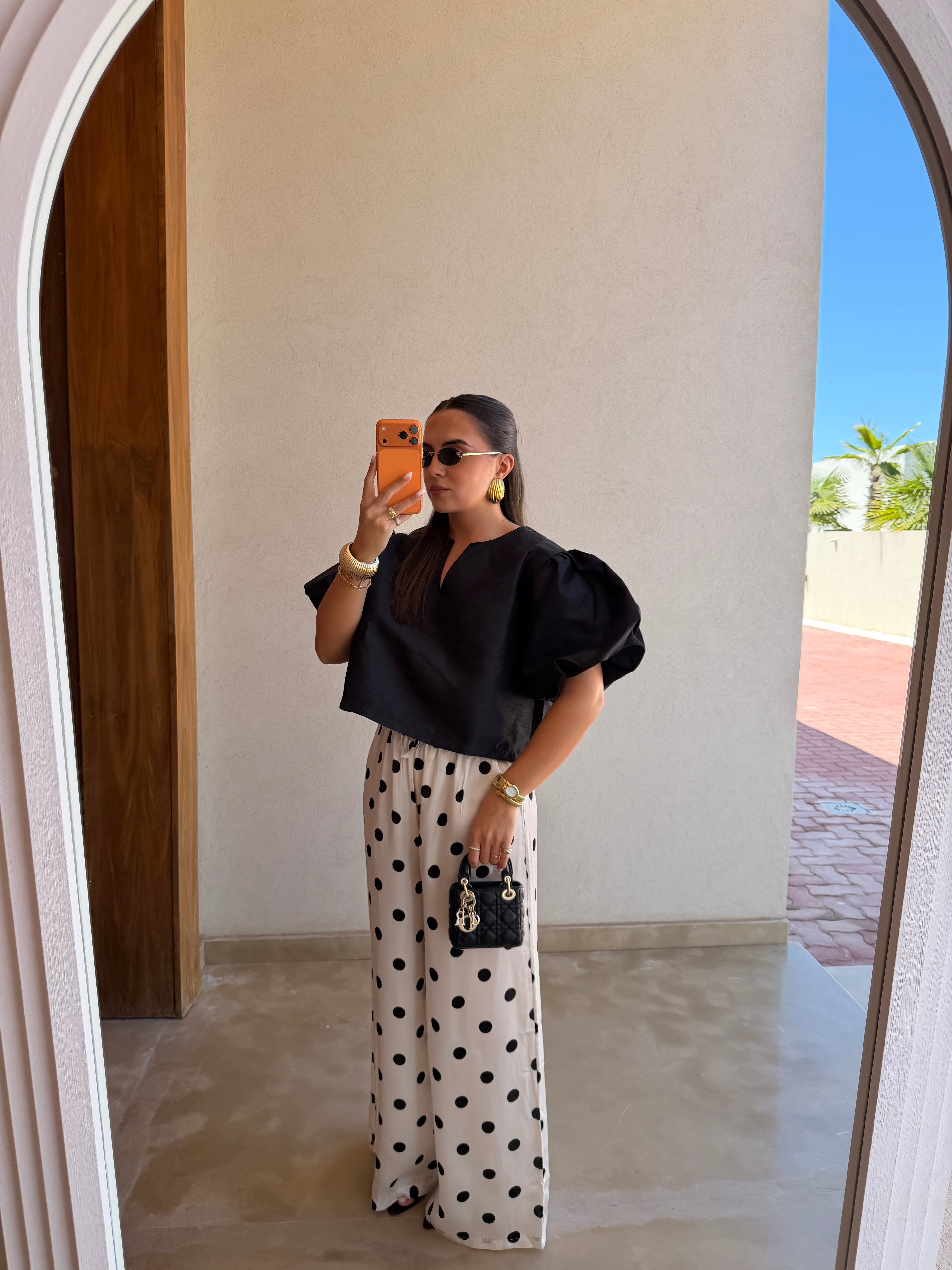 Pantalon satiné à pois blanc